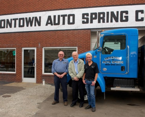 Uniontown Auto Spring Staff Members in front of Facility