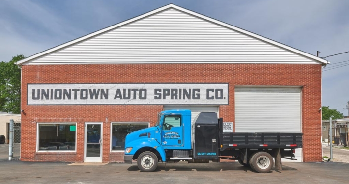 Uniontown Auto Spring Exterior Facility Detail with Parts Truck
