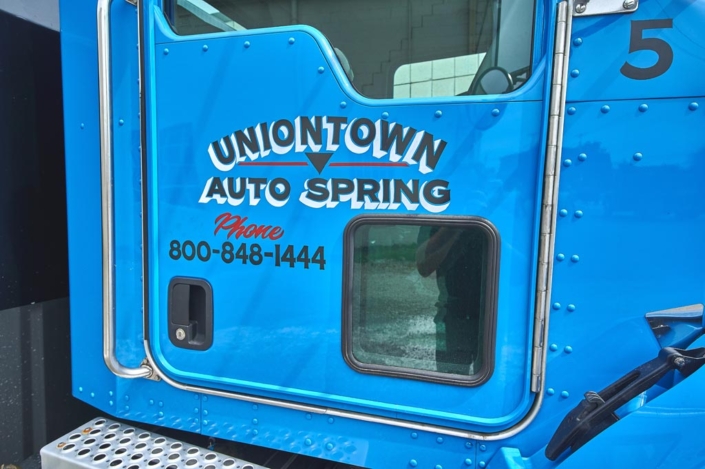 Uniontown Auto Spring Door Detail of Parts Truck
